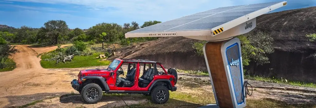 Red 2023 Jeep Wrangler at station