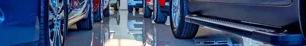 Low angle showing car wheels banner