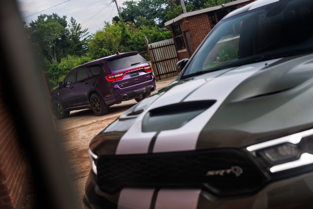 2026 Dodge Durango SRT Hellcat Jailbreak in Green Machine (front). A Jailbreak Custom Color program will allow select Dodge customers to paint their Durango SRT Hellcat Jailbreak in nearly any color imaginable, including Stryker Purple (shown at rear).